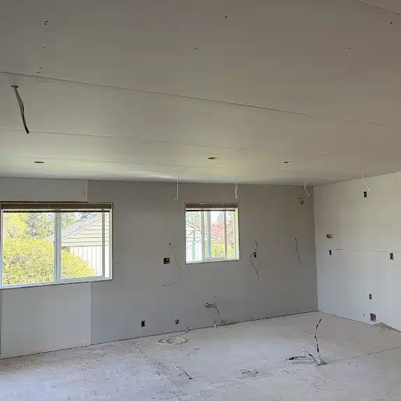 Empty room with drywall and windows