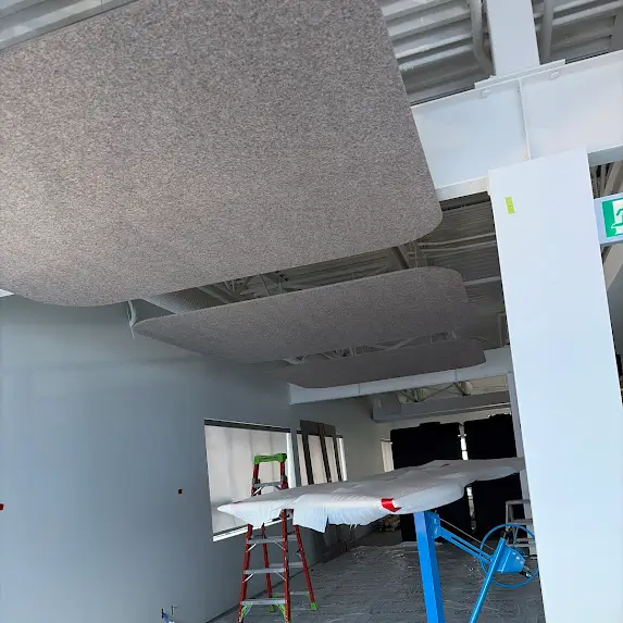 Suspended acoustic panels in construction area
